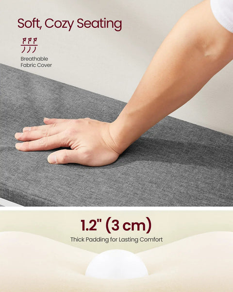 Close-up of a hand pressing the padded seat of the Open Storage Shoe Bench With Padded Seat And 20 Compartments, showcasing comfort.