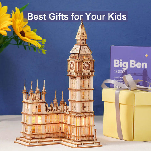 3D Wooden Puzzle Of Big Ben For Adults A Hands On Model Kit That Brings London Landmarks To Life Totally Epic Gift For Puzzle Nerds 14 Plus Hobby Builders wooden Big Ben model kit on display beside gift box