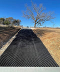 Vodaland Permeable Pavers EasyPave Grass And Gravel Driveway Grid 2 Inch Depth 35 Square Feet 14 Units Black 100 Percent Recycled Plastic installed on a sloped driveway