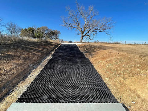 Vodaland Permeable Pavers EasyPave Grass And Gravel Driveway Grid 2 Inch Depth 35 Square Feet 14 Units Black 100 Percent Recycled Plastic installed on a sloped driveway