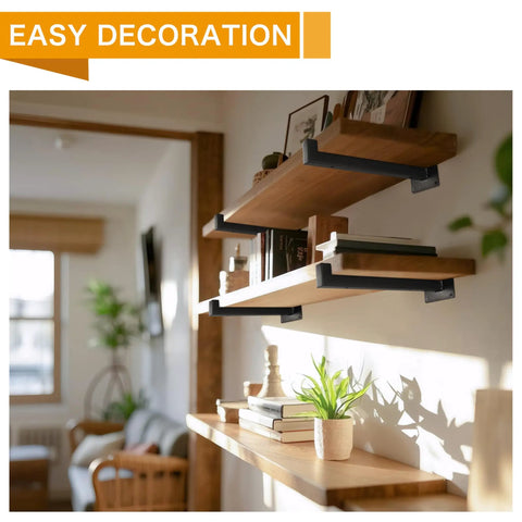 Wooden shelves with books and plants mounted on beefy 6 inch black shelf brackets set for wall mounting heavy duty industrial shelving supports