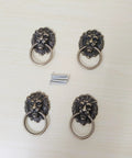 Antique Bronze Lion Head Ring Pull Cabinet Handles Set Of 4 With Screws, 2.6 Inches Long By 1.6 Inches Wide on light surface