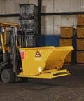 Commercial Grade 1 Cubic Yard Self Dumping Hopper Fits Standard Forklifts 6000 Lb Capacity Heavy Duty in warehouse setting.
