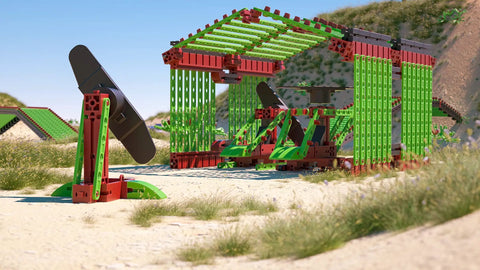 80 Piece Solar Construction Kit Lets Kids Build A Helicopter Air Boat Or Fan With A Solar Rotor Powering The Propeller While Teaching Renewable Energy In A Fun STEM Hands On Way. Solar STEM kit with helicopter and fan models on a beach