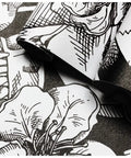Close-up of Dope Gothic Peel And Stick Wallpaper With Sugar Skull Floral Pattern For Bedroom In Black And White Removable Accent Wall Decor Durable Vinyl Easy To Install And Renters Friendly 17.7 Inch By 9.8 Foot showing intricate floral and skull design.
