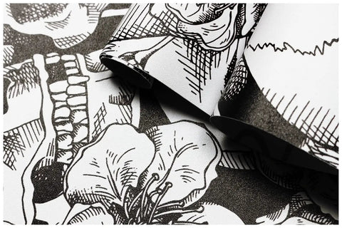 Close-up of Dope Gothic Peel And Stick Wallpaper With Sugar Skull Floral Pattern For Bedroom In Black And White Removable Accent Wall Decor Durable Vinyl Easy To Install And Renters Friendly 17.7 Inch By 9.8 Foot showing intricate floral and skull design.