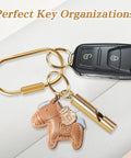 Slick Gold Brass Key Ring Organizer Set 8 Pack with car key and charm for everyday carry.