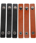 Six Piece Leather Cable Wraps That Straight Up Keep Your Charging Cords Earphones And Phone Wires Tangle Free For Road Trips Commuting And Clean Desk Setup, shown in black and brown.