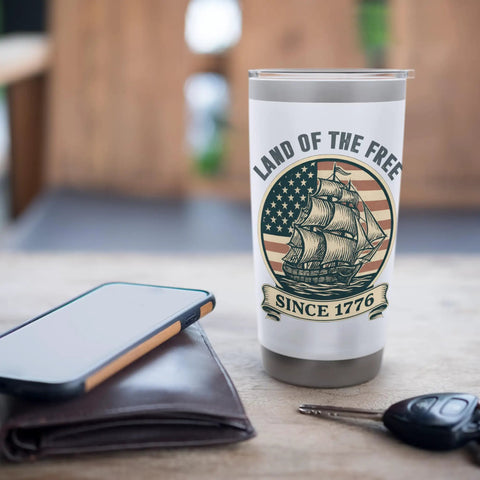 Patriotic Stainless Steel Insulated Tumbler With Vintage American Flag Sailboat Design Red White And Blue Vibes on a table