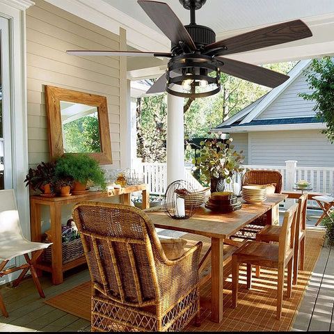 Retractable Caged Ceiling Fan With Lights For Indoor And Outdoor Use Dope Industrial Low Profile Ceiling Fan With Reversible DC Motor 36 Inch Size Large Airflow Retractable Blades Rust Proof Metal Frame over a patio dining set.