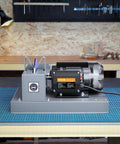 Heavy Duty Lawn Mower Blade Sharpener with a 500 Watt motor and 7-inch grinding wheel on a workbench.