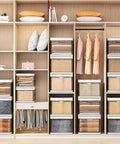 Closet with Three-Pack Stackable Clothes Organizer Bins with Sliding Rails and Removable Lids, organized T-shirts and pants visible