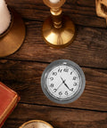 Top view of Clock Insert Kit 1-7/16 Inch Dial Fits 1-3/8 Inch Hole with White Dial, Black Arabic Numerals on wooden table