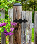 Matte Black 10 Pack Heavy Duty Fence Gate Hinges on wooden garden fence with purple flowers