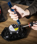 Manual ESD Safe Desoldering Pump With Aluminum Body for electronics repairs, shown in use with a soldering iron on a PCB component.