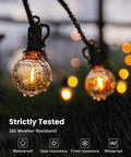 Close-up of Outdoor String Lights 29 Feet G40 LED Patio Lighting Plug In With 13 Plastic Edison Bulbs in rain showing waterproof feature
