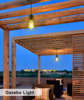 Solar Pendant Lights With Pull Cord And Remote For Outdoor Indoor Use illuminating a gazebo patio scene at dusk