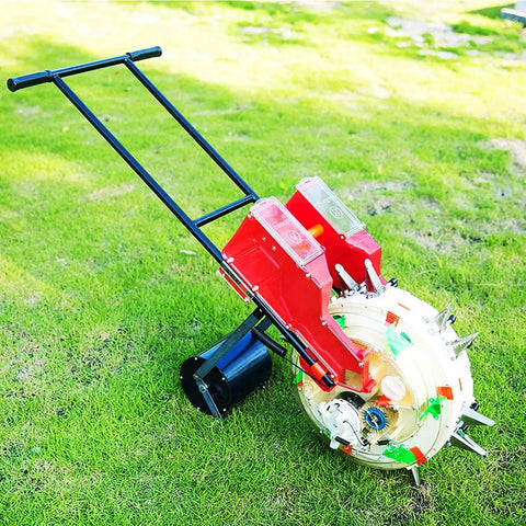 Portable Manual Garden Seeder With Dual Seed And Fertilizer Buckets on grass, featuring hand push and metal spreader roller seeder.