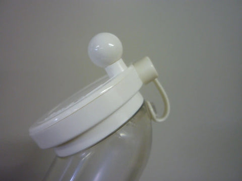 Plastic Sesame Grinder White Made In Japan, Handy Kitchen Gadget For Spices And Seeds, close-up of white handle and lid