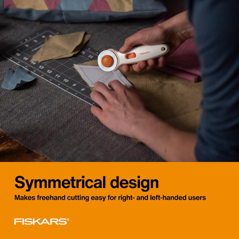 Person using 45mm Rotary Cutter For Fabric, Cuts Through Multiple Layers, Left Or Right Handed, Easy Safe Blade Change tool