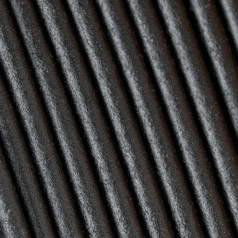 Close-up of Polymaker Panchroma Matte PLA filament in charcoal black, 1.75 mm, 1 kg spool