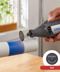 Dremel 4000-2/32 rotary tool with cutting disc cutting a blue-taped PVC pipe