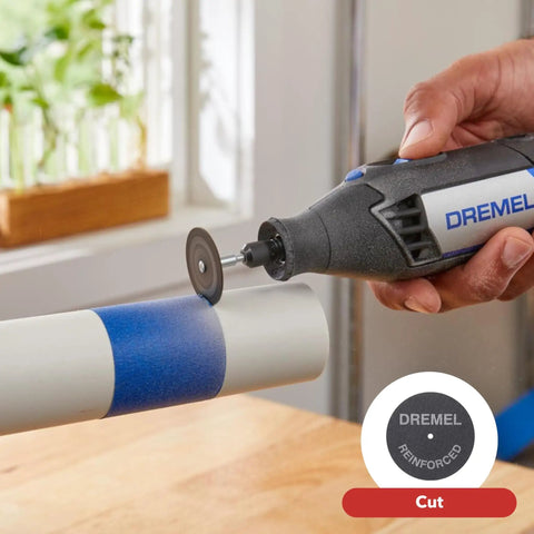 Top Notch Variable Speed Rotary Tool Kit With Badass One Point Six Amp Motor Dialing Up To Thirty Five Thousand Rpm For Precision Engraving Detail Sanding And Wood Carving Includes 25 Premium Accessories Get You Working Fast, cutting a blue-painted PVC pipe.