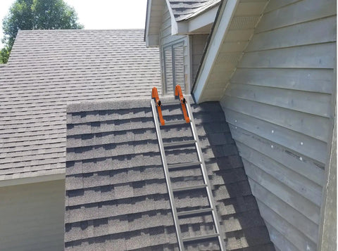 Two Pack Roof Ladder Hooks With Wheel Stabilizers For Built Tough Steel Support on steep roof.