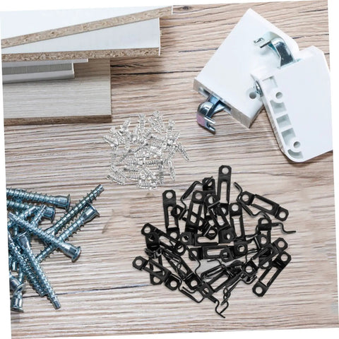 Dead Simple 30 Piece Heavy Duty Metal Furniture Joint Snap Connectors For Sofa Cabinet Assembly No Sweat Tool Free Setup For Smooth Diy Wood Fix Projects scattered on a wood surface with screws and hardware.