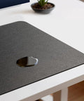 Premium Leather Desk Pad Mat Non Slip Blotter Desk Protector For Office And Home 17 By 12 Inches Shields Your Desk From Scratches Stains And Spills Easy To Clean Perfect For Lap Desks Laptops And Desktops showing a water spill