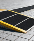 Heavy-Duty Anti-Slip Tape 18 In By 40 Ft For Indoor Outdoor Use On Ramps Stairs Garage Floors Warehouses And Workshops Black Abrasive Non-Slip Grip Roll installed on a ramp