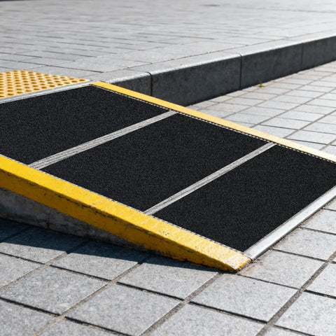 Heavy-Duty Anti-Slip Tape 18 In By 40 Ft For Indoor Outdoor Use On Ramps Stairs Garage Floors Warehouses And Workshops Black Abrasive Non-Slip Grip Roll installed on a ramp