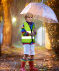 Child wearing Kids High Visibility Safety Vests Bulk Pack Of 10 Neon Reflective Traffic Vests With Zippers For Ages 3 To 10 in rain