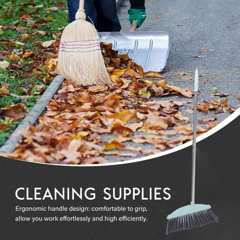 Grime Crushing Heavy Duty Broom With 34 Inch Long Handle For Sweeping Concrete Driveway Garage Patio And Indoor Floors No Sweat Household Cleaner With Convenient Storage Hook in use on leaves.