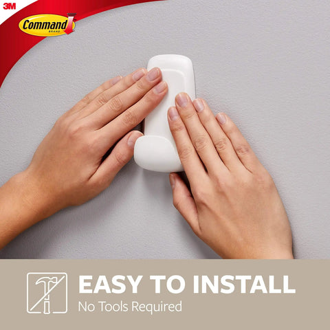 Damage-Free Jumbo Hook Set With 8 Strong Strips being installed by hands, showcasing easy no-tools setup on a wall.