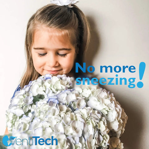 Smiling girl holding white flowers with 'No more sneezing' text on the side.
