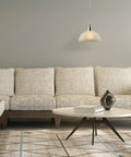 Dead Center Style Plug And Play Pendant With Brushed Steel Finish Frosted White Shade And A No Sweat 15 Foot Clear Cord With Inline Switch above a modern sofa.