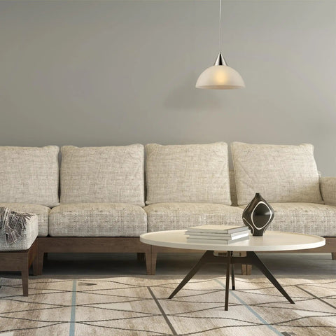 Dead Center Style Plug And Play Pendant With Brushed Steel Finish Frosted White Shade And A No Sweat 15 Foot Clear Cord With Inline Switch above a modern sofa.