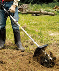 KR401MP Cultivator Couple Shaft Attachment in use, tilling soil with 9-inch 6-tine steel blade, shows lightweight drive shaft