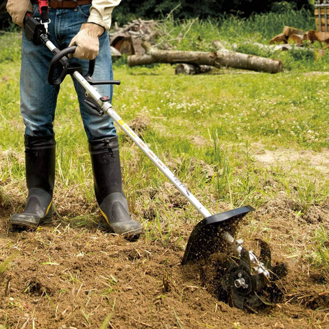 KR401MP Cultivator Couple Shaft Attachment in use, tilling soil with 9-inch 6-tine steel blade, shows lightweight drive shaft