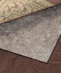 3 Ft By 11 Ft Rug Pad With Dual Surface Felt And Rubber Grip That Grabs Rugs In Place Quarter Inch Thick Non Slip Backing For Hardwood Tile Laminate And All Floor Types Brown, showing layered materials on hardwood