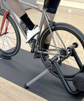 Cyclist using Smart Wheel On Bike Trainer With Bluetooth And ANT Plus Connectivity For Zwift And Onelap Indoor Cycling Stand