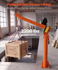 VEVOR 2200 Lbs Electric Pickup Truck Crane With Hoist & Wireless Remote, 360 Rotating Telescopic Boom lifting a wooden crate.