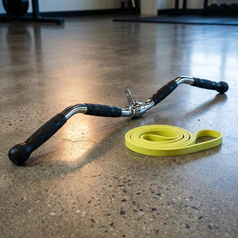 Lat Bar Cable Machine Attachment With Full Rotation Rubber Grip 30 Inch Pulldown Bar on gym floor