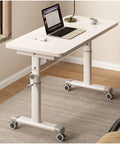 Straight Up Reliable Manual Sit Stand Desk With Rock Solid Frame Smooth Glide Adjustment Crisp White Surface, 32 inch wide, with laptop.