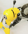 Real Deal Sectional Sewer Snake Machine 1.5 HP Drain Cleaner with yellow body and 120 foot cable coiled on the side.