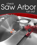 A Line It Deluxe Table Saw Alignment Tool With Digital Dial Indicator next to saw blade, measuring arbor run-out
