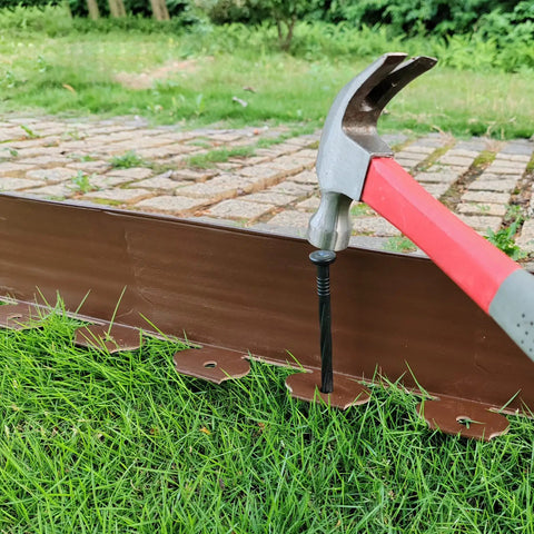 DIY Friendly 20Ft Plastic Garden Edging Kit With 25 Stakes Four Point Five Inch Tall Lawn Border being installed with hammer
