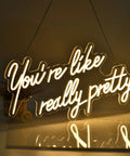 You Are Like Really Pretty White LED Neon Sign For Wall Decor 28 Inches With Dimmable Switch glowing in dark room
