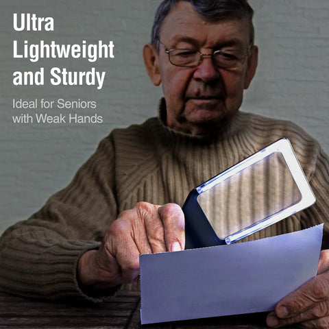 Elderly man using 3X Large Lighted Magnifying Glass With Anti Glare Lens And Stepless Dimmable LEDs for reading fine print